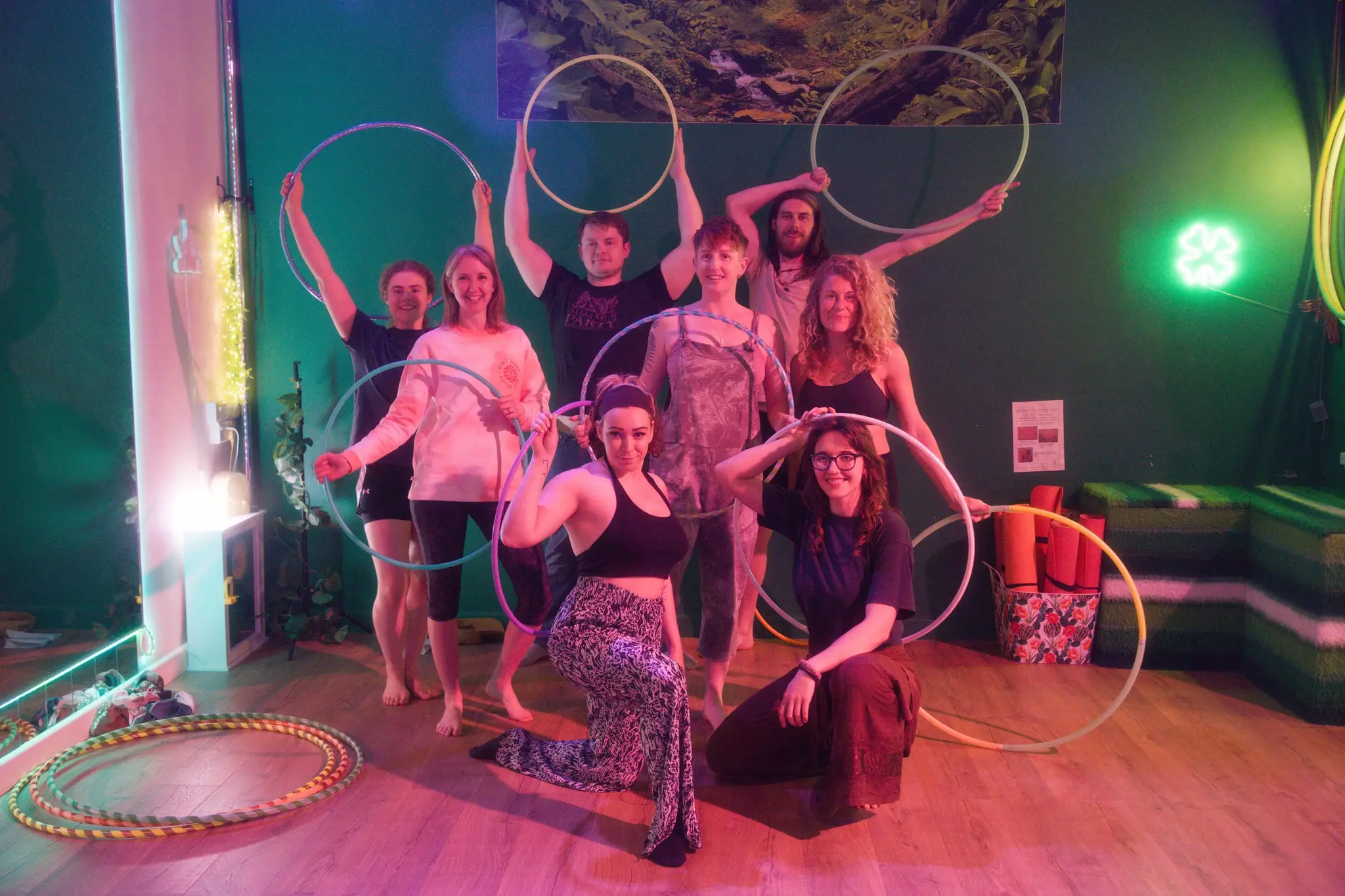 Flowsha workshop group holding their hoops up for a group photo